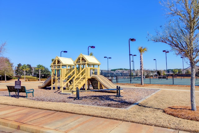 view of playground featuring tennis court