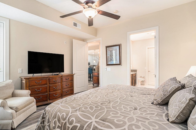 145 Pier View St Unit 111, Charleston, SC 29492 - bedroom featuring ensuite bathroom, ceiling fan, and wood finished floors