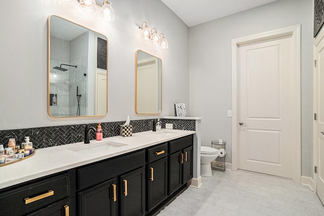 145 Pier View St Unit 111, Charleston, SC 29492 - bathroom featuring a shower stall, double vanity, and decorative backsplash