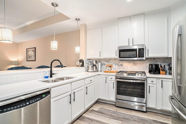 145 Pier View St Unit 111, Charleston, SC 29492 - kitchen featuring stainless steel appliances, decorative backsplash, white cabinetry, and crown molding