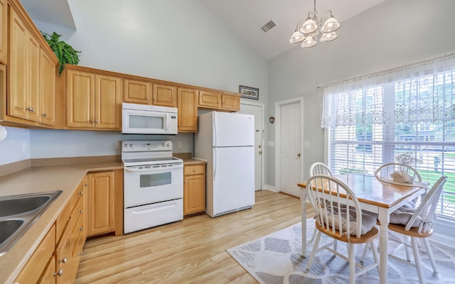 5347 Sundial Ct, North Charleston, SC 29418 - kitchen with white appliances, high vaulted ceiling, a chandelier, light wood-style floors, and light countertops