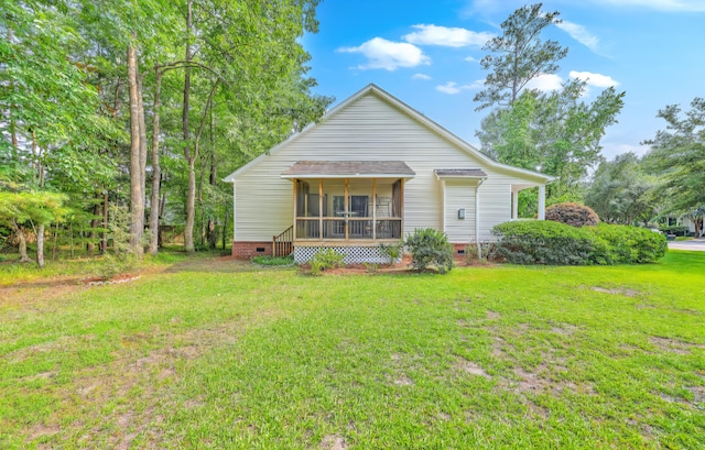 5347 Sundial Ct, North Charleston, SC 29418 - view of front facade featuring crawl space, a sunroom, a front lawn, and a shingled roof