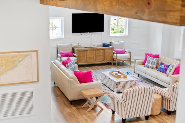 112 E Huron Ave Unit C, Folly Beach, SC 29439 - living room featuring visible vents and wood finished floors