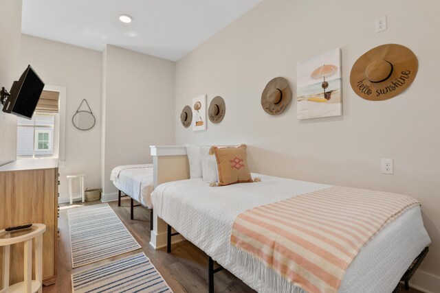 112 E Huron Ave Unit C, Folly Beach, SC 29439 - bedroom with baseboards and wood finished floors