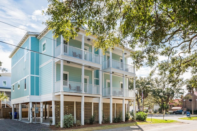 112 E Huron Ave Unit C, Folly Beach, SC 29439 - view of building exterior with a carport