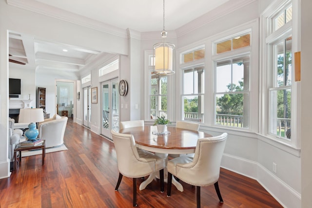 dining space with coffered ceiling, dark wood finished floors, and a wealth of natural light