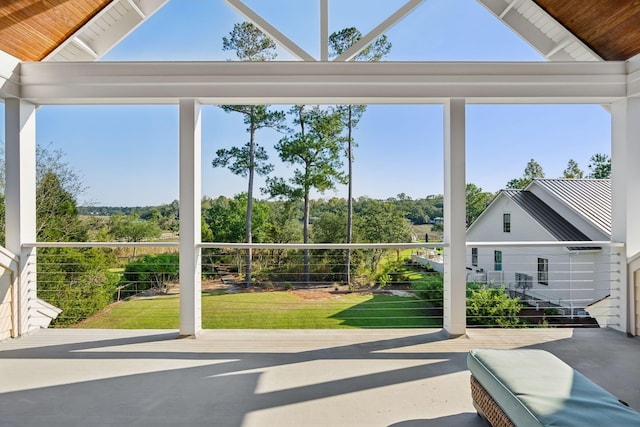 sunroom / solarium with wooden ceiling and vaulted ceiling