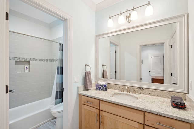 bathroom with shower / tub combo with curtain, vanity, and toilet