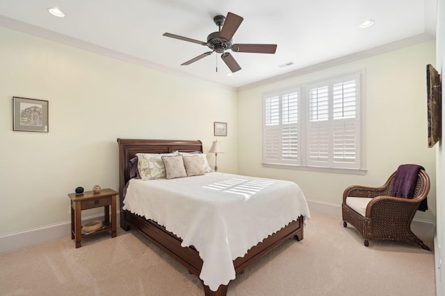 bedroom featuring baseboards, ornamental molding, visible vents, and light colored carpet