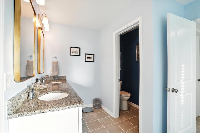 2324 Town Woods Rd, Charleston, SC 29414 - bathroom with tile patterned floors, toilet, baseboards, and double vanity