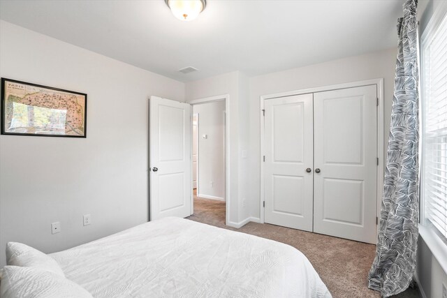 2324 Town Woods Rd, Charleston, SC 29414 - bedroom with carpet flooring, a closet, and baseboards
