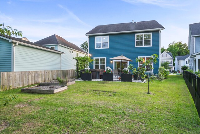 2324 Town Woods Rd, Charleston, SC 29414 - rear view of house featuring a vegetable garden and a patio