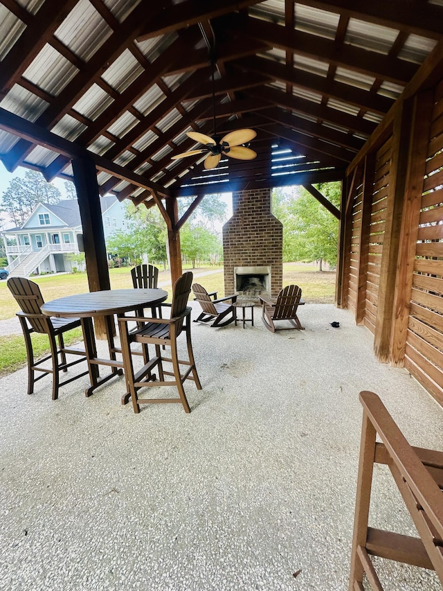 2324 Town Woods Rd, Charleston, SC 29414 - view of patio / terrace with an outdoor brick fireplace, ceiling fan, and outdoor dining space