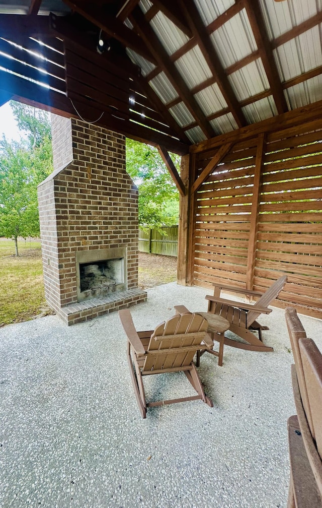 2324 Town Woods Rd, Charleston, SC 29414 - view of patio / terrace with an outdoor brick fireplace and fence
