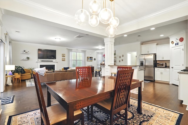 2324 Town Woods Rd, Charleston, SC 29414 - dining area featuring ornate columns, dark wood-type flooring, ornamental molding, a fireplace, and recessed lighting