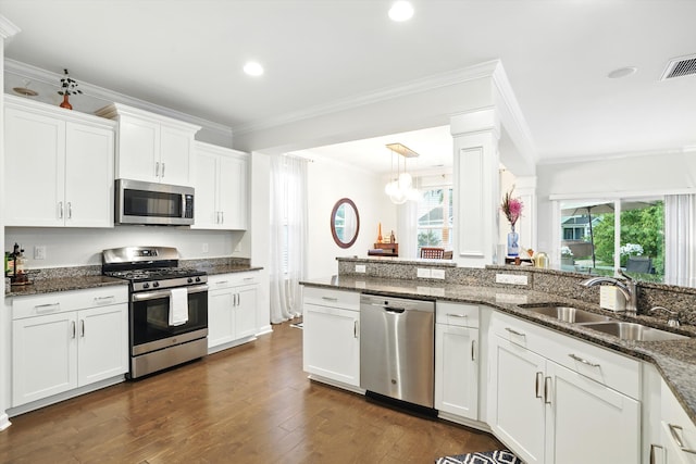 2324 Town Woods Rd, Charleston, SC 29414 - kitchen featuring stainless steel appliances, a sink, ornamental molding, white cabinetry, and recessed lighting