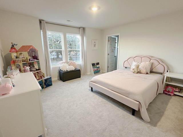 bedroom with light colored carpet and visible vents