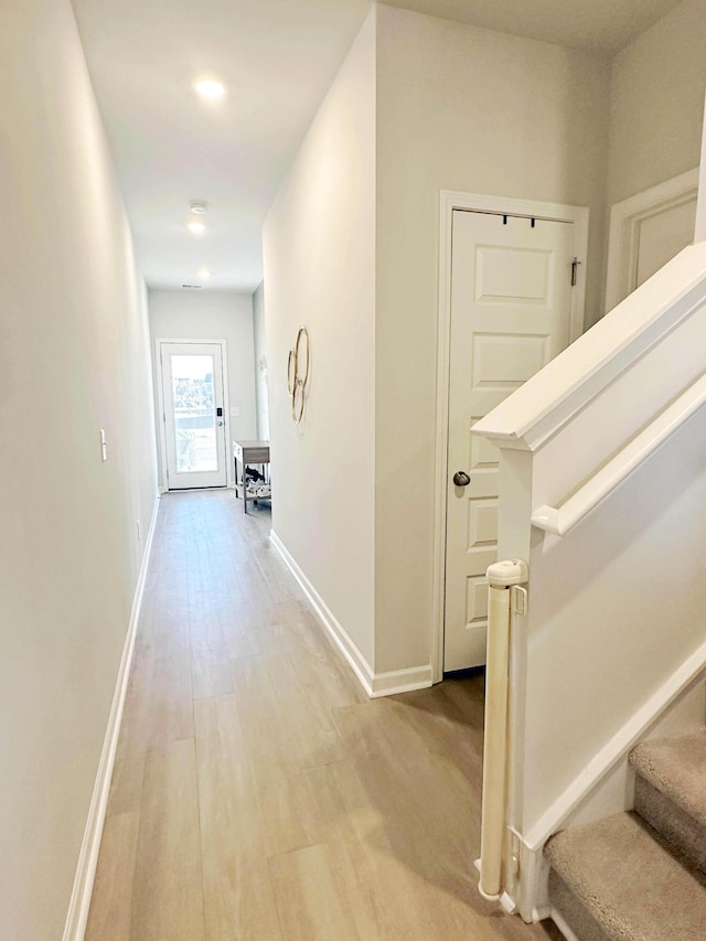 hallway with light wood-type flooring