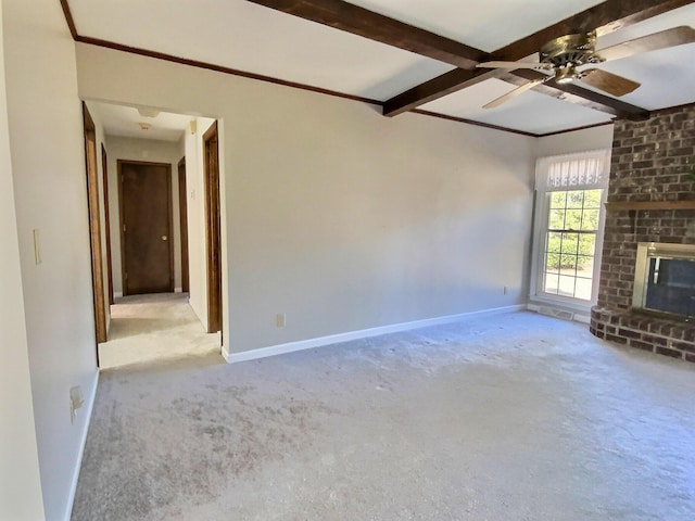 unfurnished living room with light carpet, ceiling fan, a fireplace, and beamed ceiling