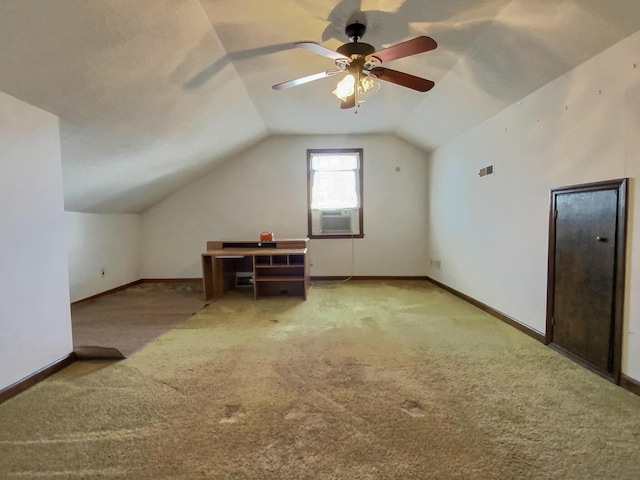 additional living space featuring ceiling fan, vaulted ceiling, and light carpet