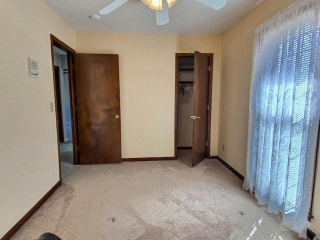 unfurnished bedroom with light carpet and ceiling fan