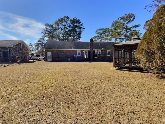 back of house with a yard