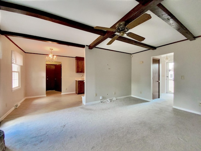 unfurnished living room featuring crown molding, light colored carpet, beam ceiling, and ceiling fan with notable chandelier