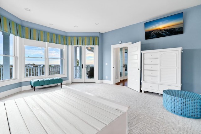 bedroom with carpet, french doors, and access to outside