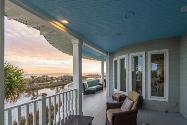 balcony at dusk with a water view