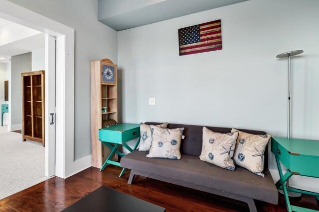 living room with dark hardwood / wood-style flooring