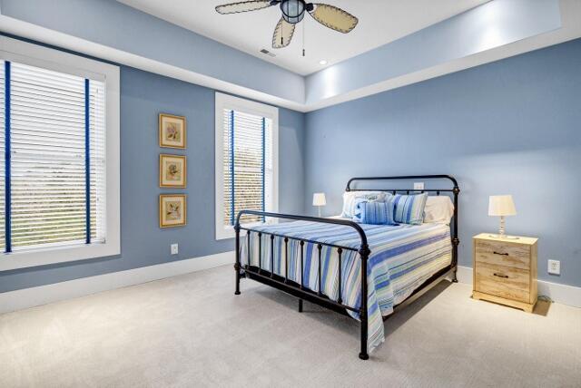 carpeted bedroom with ceiling fan