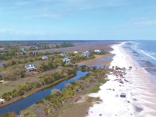 bird's eye view featuring a view of the beach and a water view