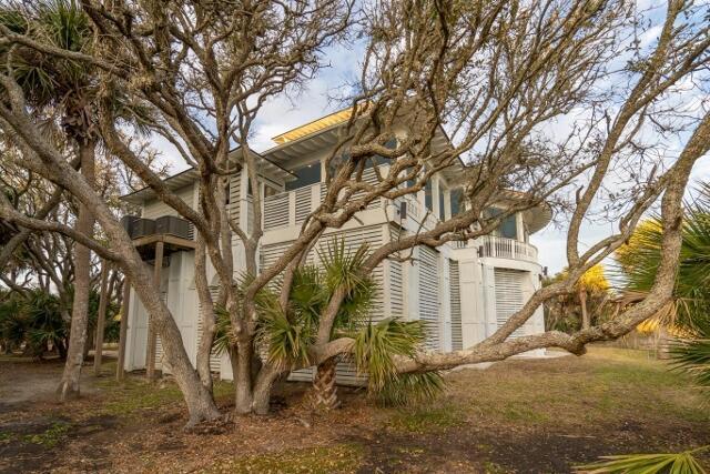 view of side of property with a balcony