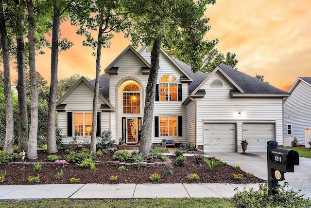 1311 Royal Links Dr, Mount Pleasant, SC 29466 - traditional home featuring concrete driveway, a garage, and a shingled roof