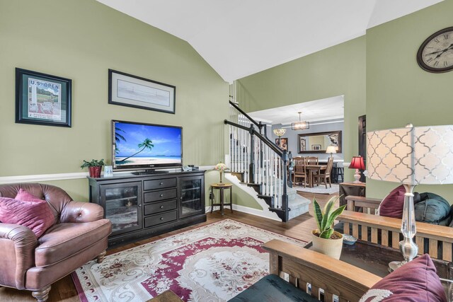 1311 Royal Links Dr, Mount Pleasant, SC 29466 - living area with vaulted ceiling, wood finished floors, stairs, and a chandelier
