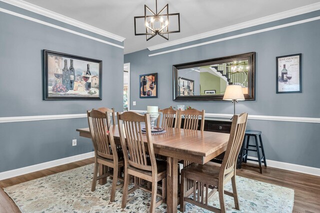 1311 Royal Links Dr, Mount Pleasant, SC 29466 - dining space with a chandelier, wood finished floors, and ornamental molding