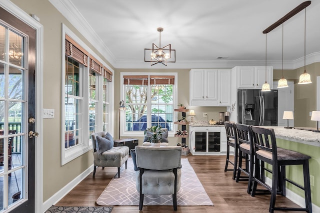 1311 Royal Links Dr, Mount Pleasant, SC 29466 - dining area featuring a chandelier, dark wood finished floors, and crown molding