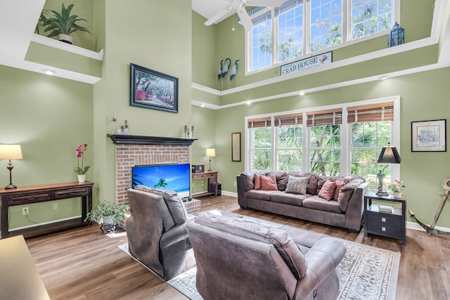 1311 Royal Links Dr, Mount Pleasant, SC 29466 - living area with a towering ceiling, plenty of natural light, a brick fireplace, and a ceiling fan