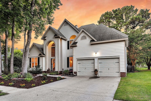 1311 Royal Links Dr, Mount Pleasant, SC 29466 - traditional-style house with driveway, a shingled roof, a front yard, and a garage
