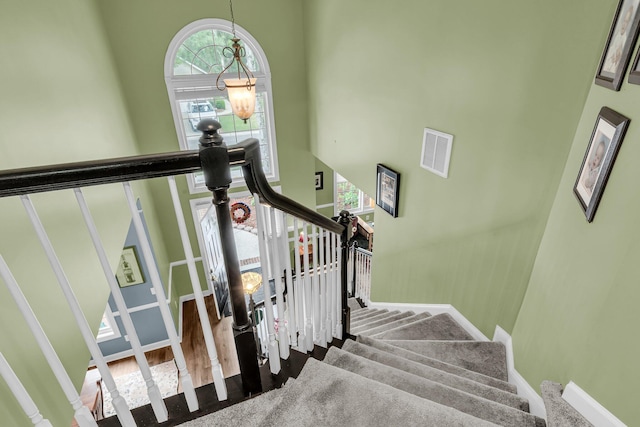1311 Royal Links Dr, Mount Pleasant, SC 29466 - stairs featuring a high ceiling and a chandelier