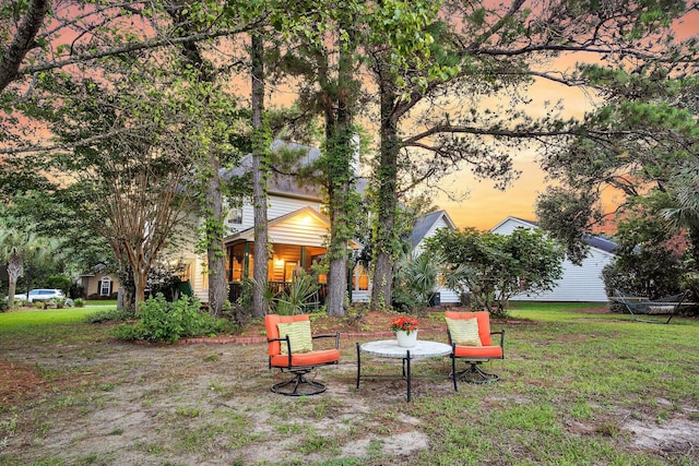1311 Royal Links Dr, Mount Pleasant, SC 29466 - yard at dusk featuring a lawn