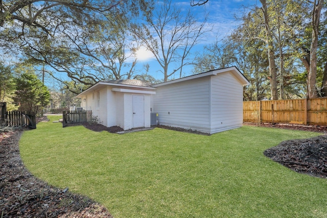 exterior space featuring an outbuilding and a fenced backyard