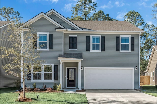 1083 Danner Dr, Bluffton, SC 29909 - view of front facade with a front lawn, concrete driveway, roof with shingles, and an attached garage
