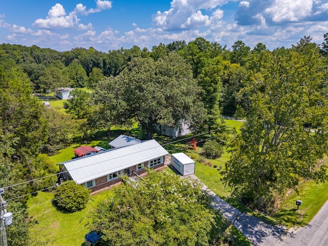 aerial view featuring a wooded view