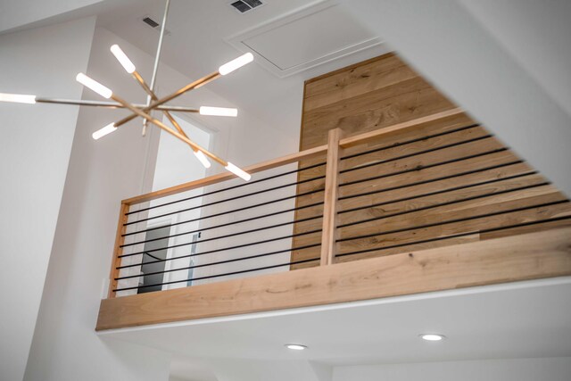 room details featuring recessed lighting, visible vents, and an inviting chandelier