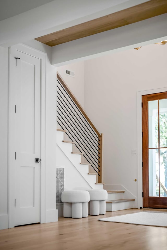 staircase featuring wood finished floors