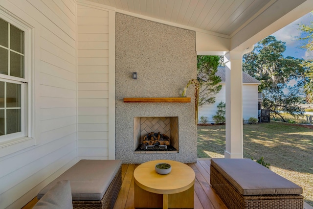 view of patio / terrace featuring exterior fireplace