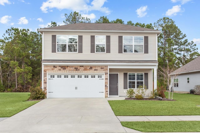 view of front of house featuring a garage and a front yard