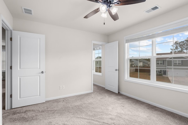 interior space with ceiling fan