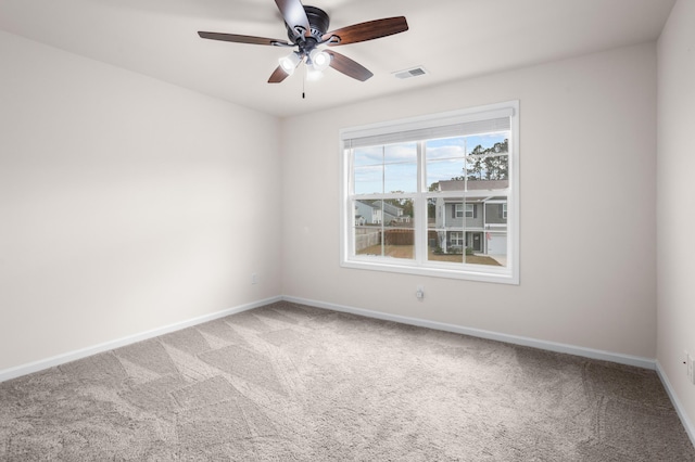 carpeted empty room featuring ceiling fan